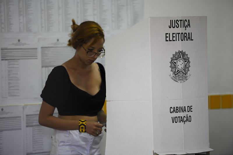 A voter at an electronic voting booth during Brazil's first-round election, October 2026